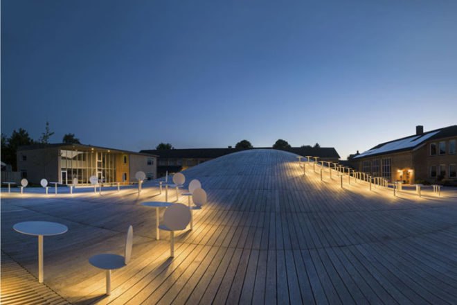 BIG, underground facility, form follows function, retrofit architecture, courtyard, custom benches, LED lighting, solar panels, underground architecture, organic courtyard
