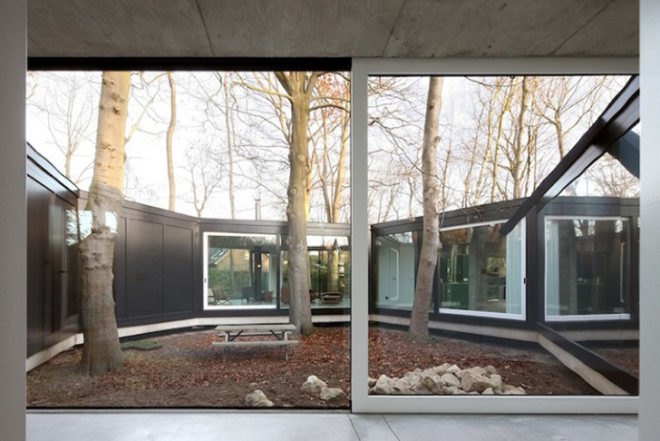 Architecten DVVT, glazed, donut, House BM, windows, natural light, Belgium, stilts, surrounded by trees, architecture, Daylighting,