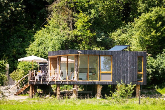 Upfrnt Architects, South Limburg house, house on stilts, wooden house, Netherlands architecture, wastewater purification, holiday house, weekend retreat, Shou-Sugi-Ban, daylit homes, glass facades, underground ventilation, solar panels, energy efficient building, solar energy