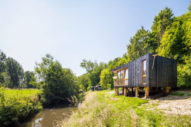 Upfrnt Architects, South Limburg house, house on stilts, wooden house, Netherlands architecture, wastewater purification, holiday house, weekend retreat, Shou-Sugi-Ban, daylit homes, glass facades, underground ventilation, solar panels, energy efficient building, solar energy