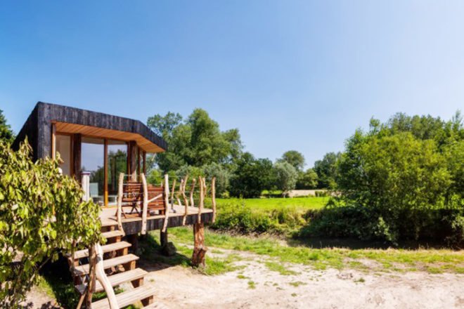 Upfrnt Architects, South Limburg house, house on stilts, wooden house, Netherlands architecture, wastewater purification, holiday house, weekend retreat, Shou-Sugi-Ban, daylit homes, glass facades, underground ventilation, solar panels, energy efficient building, solar energy