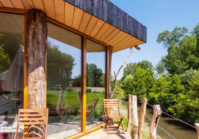 Upfrnt Architects, South Limburg house, house on stilts, wooden house, Netherlands architecture, wastewater purification, holiday house, weekend retreat, Shou-Sugi-Ban, daylit homes, glass facades, underground ventilation, solar panels, energy efficient building, solar energy