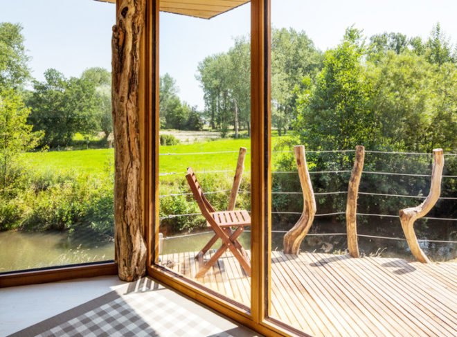 Upfrnt Architects, South Limburg house, house on stilts, wooden house, Netherlands architecture, wastewater purification, holiday house, weekend retreat, Shou-Sugi-Ban, daylit homes, glass facades, underground ventilation, solar panels, energy efficient building, solar energy