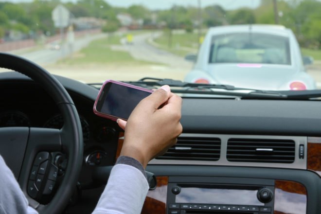 guy texting while driving, guy texting, texting while driving