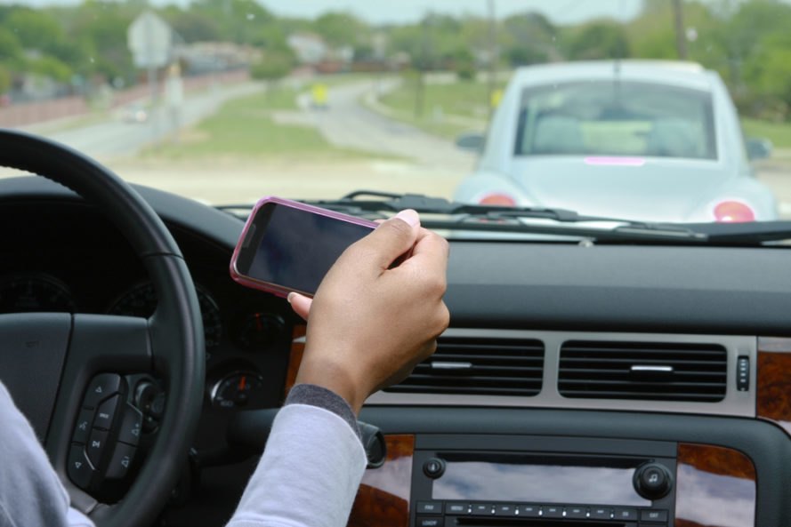 guy texting while driving, guy texting, texting while driving