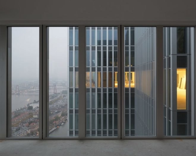oma, rem koolhaas, de rotterdam, vertical city, erasmus bridge, Wilhemina Pier, mixed use building, mullions, multipurpose building, Rotterdam skyline, floor to ceiling windows, rotterdam economic revival