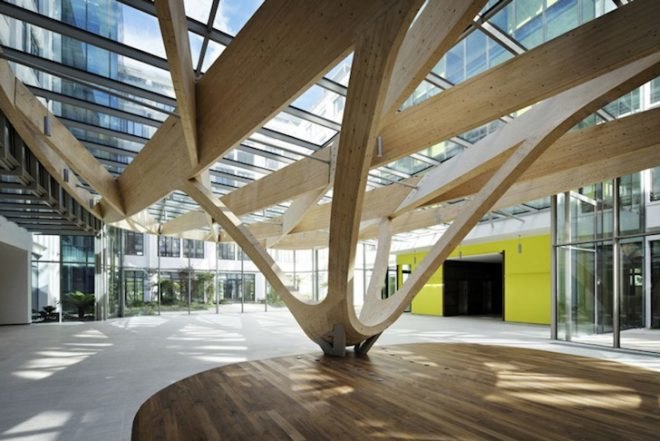 Agence Jouin Manku, office space, amenities wing, Société Foncière Lyonnaise, IN/OUT, iridescent shingles, stainless steel tiles, glass pavilion, bush hammered concrete, contemporary architecture, avant garde architecture
