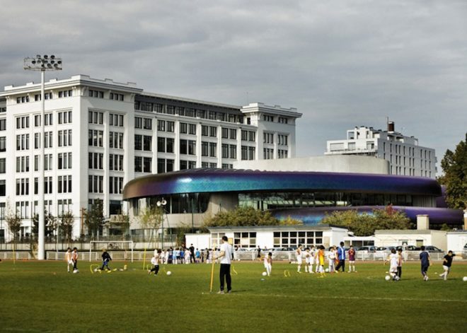 Agence Jouin Manku, office space, amenities wing, Société Foncière Lyonnaise, IN/OUT, iridescent shingles, stainless steel tiles, glass pavilion, bush hammered concrete, contemporary architecture, avant garde architecture