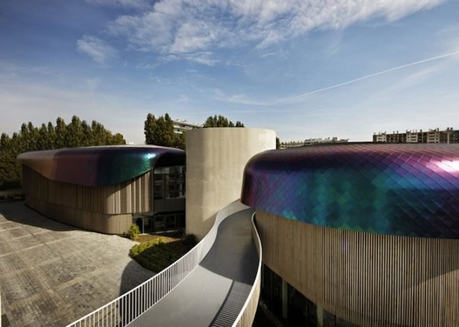 Agence Jouin Manku, office space, amenities wing, Société Foncière Lyonnaise, IN/OUT, iridescent shingles, stainless steel tiles, glass pavilion, bush hammered concrete, contemporary architecture, avant garde architecture