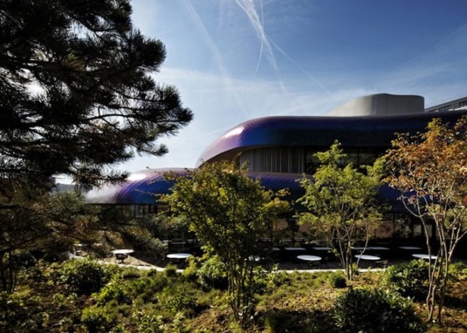 Agence Jouin Manku, office space, amenities wing, Société Foncière Lyonnaise, IN/OUT, iridescent shingles, stainless steel tiles, glass pavilion, bush hammered concrete, contemporary architecture, avant garde architecture