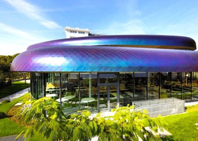Agence Jouin Manku, office space, amenities wing, Société Foncière Lyonnaise, IN/OUT, iridescent shingles, stainless steel tiles, glass pavilion, bush hammered concrete, contemporary architecture, avant garde architecture