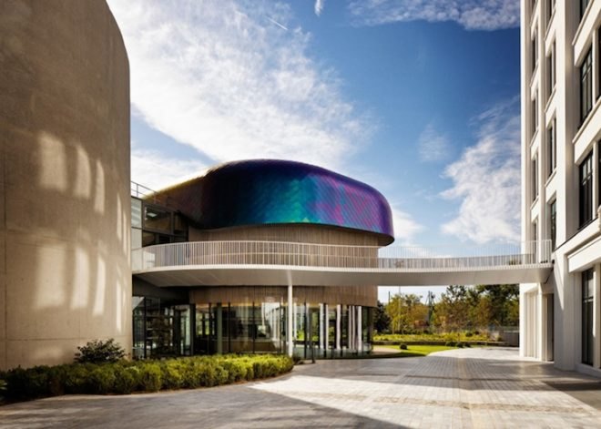 Agence Jouin Manku, office space, amenities wing, Société Foncière Lyonnaise, IN/OUT, iridescent shingles, stainless steel tiles, glass pavilion, bush hammered concrete, contemporary architecture, avant garde architecture