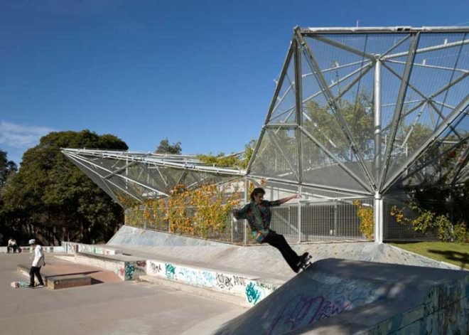 weave community center Waterloo Sydney, steel canopy, Collins and Turner, John Krubsack, Cedric Price, natural cross ventilation, exposed thermal mass, climbing plants canopy, London zoo aviary, refurbished community center Australia,