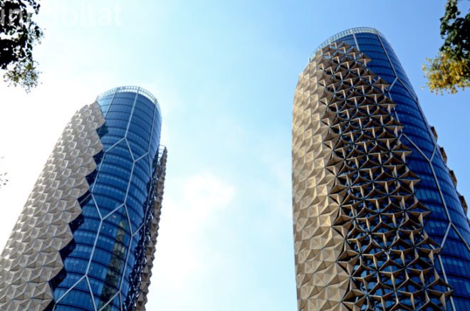 Abu Dhabi, world's largest computerized facade, Abu Dhabi Investment Council, Al Hilal Bank, Aedas Architects, external shading structures, twin towers of Abu Dhabi, mashrabiya screens, Abu Dhabi green design, LEED silver buildings in Abu Dhabi, LEED, green construction, award-winning architecture, Middle East, Gulf Region LEED, green building Gulf Region, energy efficiency, daylighting, reduce solar gain