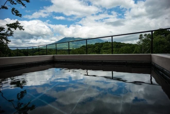 mount yotei, florian busch architects, l house, niseko, hokkaido, escarpment, retaining walls, panoramic views, cantilevered stairs, holiday home