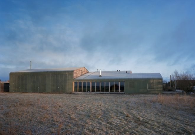 Thomas Kröger, metal-clad house, agricultural cooperative, werkhouse, iron skin, minimalist house, workshop and house, corrugated metal facade, wood chip boiler, german countryside,