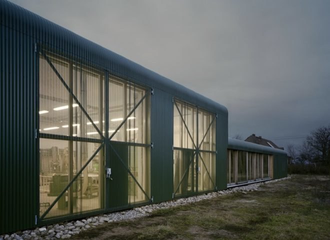 Thomas Kröger, metal-clad house, agricultural cooperative, werkhouse, iron skin, minimalist house, workshop and house, corrugated metal facade, wood chip boiler, german countryside,