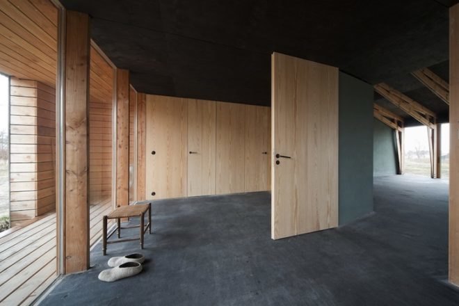 Thomas Kröger, metal-clad house, agricultural cooperative, werkhouse, iron skin, minimalist house, workshop and house, corrugated metal facade, wood chip boiler, german countryside,