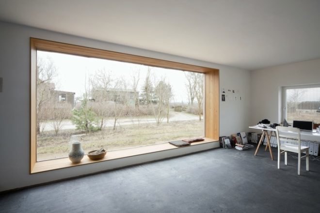 Thomas Kröger, metal-clad house, agricultural cooperative, werkhouse, iron skin, minimalist house, workshop and house, corrugated metal facade, wood chip boiler, german countryside,