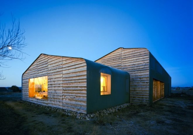 Thomas Kröger, metal-clad house, agricultural cooperative, werkhouse, iron skin, minimalist house, workshop and house, corrugated metal facade, wood chip boiler, german countryside,