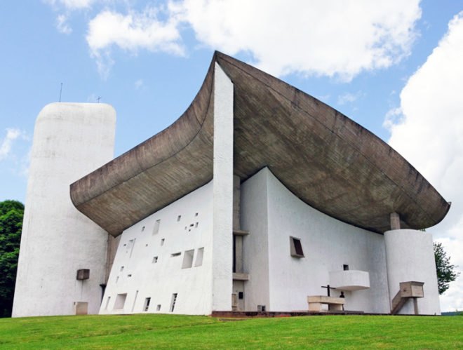 Le Corbusier, Le Corbusier Chapel of Ronchamp, Le Corbusier Ronchamp, Chapel of Ronchamp, Ronchamp France, Iconic architecture, icons of architecture, iconic church, modern architecture, mid-century architecture, international style architecture, Le Corbusier international style, Le Corbusier chapel, international style chapel, Le Corbusier structural chapel, Chapel of Ronchamp damaged, Chapel of Ronchamp vandalized, Chapel of Ronchamp window destroyed, Chapel of Ronchamp painted glass, painted glass window, Le Corbusier painted glass, Le Corbusier broken glass, Ronchamp blue window