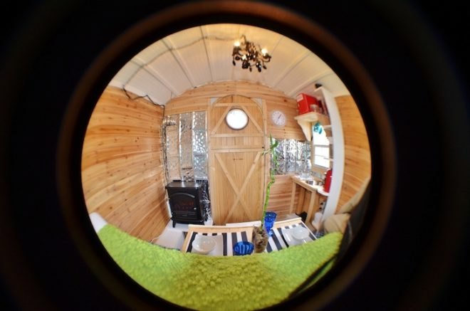 hobbit hutch, tiny home, gypsy caravan, writer's studio, james mangum, jalousie windows, fairytale home, faux wood stove, tractor supply trailer, cassette toilet, propane shower