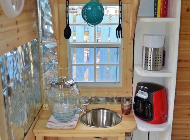 hobbit hutch, tiny home, gypsy caravan, writer's studio, james mangum, jalousie windows, fairytale home, faux wood stove, tractor supply trailer, cassette toilet, propane shower