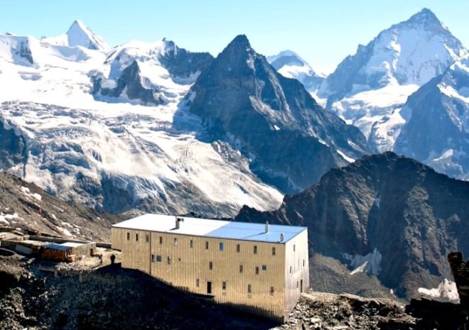 alpine hut, solar power, tracuit hut, switzerland, mountaineering, swiss alps, Savioz Fabrizzi Architectes, valais alps, bishorn, prefabricated hut, southern exposure, solar panels, stainless steel cladding, alpine climate, alpine architecture