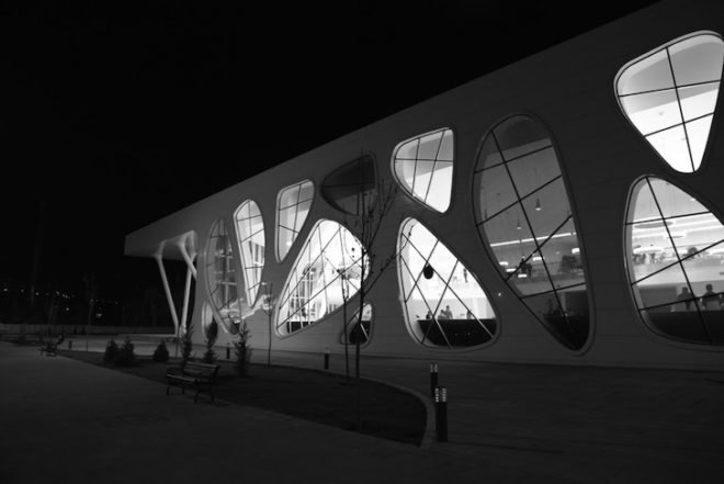 Bahadir Kul Architects, kayseri ice rink, ice rink, blob-shaped windows, turkey, kayseri, anatolian wonderland, tourism hub, mezzanine level, colorful windows, futuristic facade