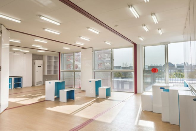 migrant workers in Shanghai, affordable community center, migrant slums, community cubes in Shanghai, curvilinear landscape benches, modular shipping containers, repurposed shipping containers, INCLUDED nonprofit organization,