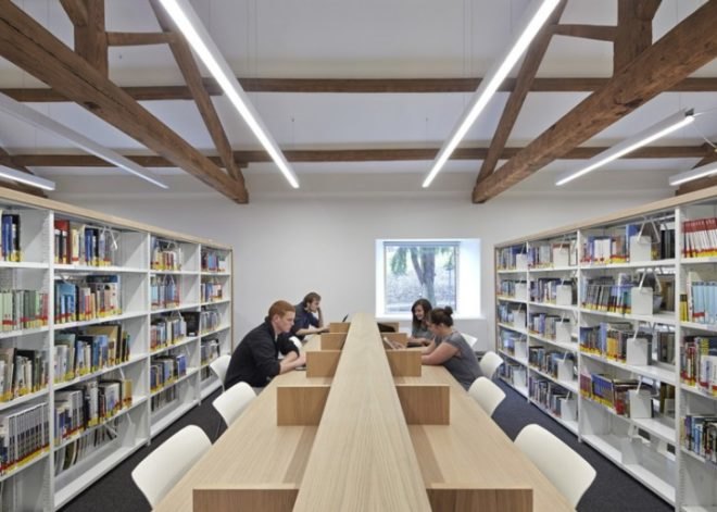 John McAslan + Partners, University of Cumbria, coverted Cumbrian barn, student center renovation cumbira, renovation, architecture, campus design, repurposed materials, landscape architecture, timber roofs, university design, UK campus redesign