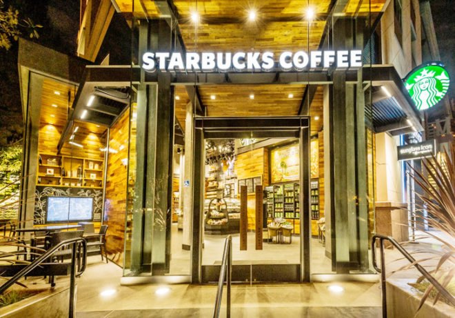 Starbucks Disney store, Starbucks LEED-certified store, LEED certification, LEED platinum cafe, Disneyland Resort Anaheim, reclaimed wood furniture, green walls, interactive installation, Disney-inspired design