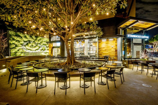 Starbucks Disney store, Starbucks LEED-certified store, LEED certification, LEED platinum cafe, Disneyland Resort Anaheim, reclaimed wood furniture, green walls, interactive installation, Disney-inspired design