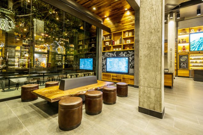 Starbucks Disney store, Starbucks LEED-certified store, LEED certification, LEED platinum cafe, Disneyland Resort Anaheim, reclaimed wood furniture, green walls, interactive installation, Disney-inspired design