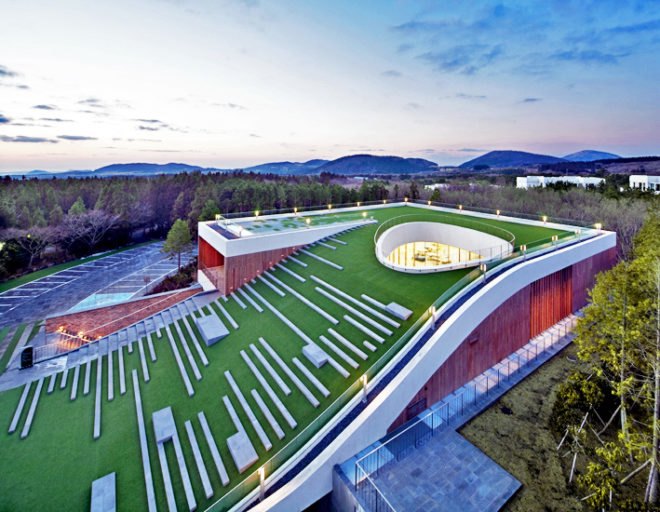Jeju island, jeju province, south korea, green roof, d lim architects, nine bridges, nine bridges golf course, multipurpose hall, CJ group, sloping green roof, timber louvers