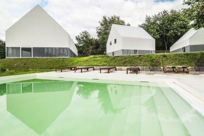 White Wolf Hotel, AND-RÉ hotel, pitched-roof houses, pitched-roof hotels, hotel Portugal, Portuguese architects, holistic design strategy, natural lighting, glass facades, daylit houses, pavilion-like hotels, pavilion architecture