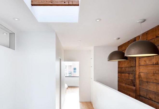 interior renovation, duplex to single-family, montreal, naturehumaine, skylight, daylighting, reclaimed wood, glass floor, historic wooden structure, 8th avenue house, rosemount, colored panels, canada