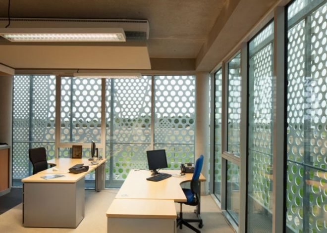 PAD Architects, Beneteau Headquarters, Givrand, France, architecture, HI-MACS, energy efficient design, french architecture, mesh screen, passive design, energy efficiency, solar gain, commercial design, commercial architecture