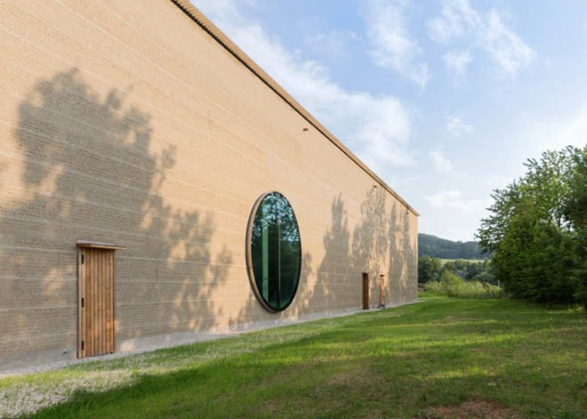 Herzog & de Meuron Ricola, Ricola laufen center, Herzog & de Meuron herb center, Herzog & de Meuron architecture, rammed earth architecture, rammed earth, sustainable building materials, locally sourced building materials, natural building material, green architecture, swiss architects