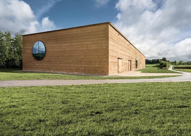 Herzog & de Meuron Ricola, Ricola laufen center, Herzog & de Meuron herb center, Herzog & de Meuron architecture, rammed earth architecture, rammed earth, sustainable building materials, locally sourced building materials, natural building material, green architecture, swiss architects