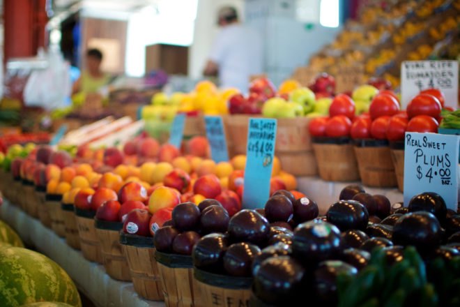 baskets of fruit at a farmers market