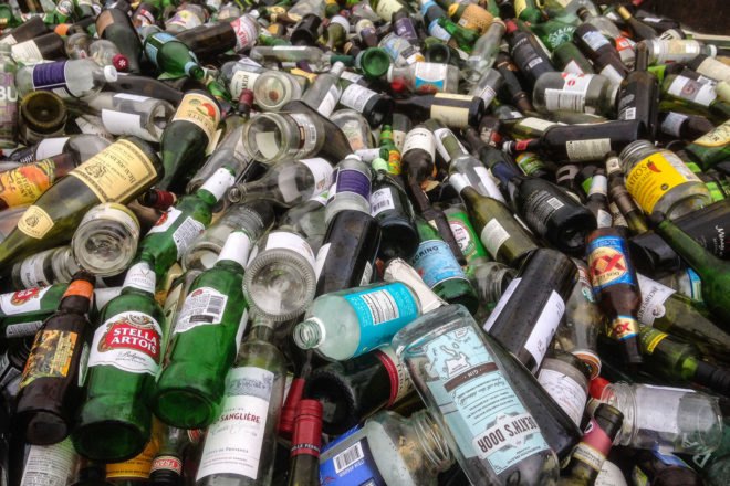 Large pile of glass bottles