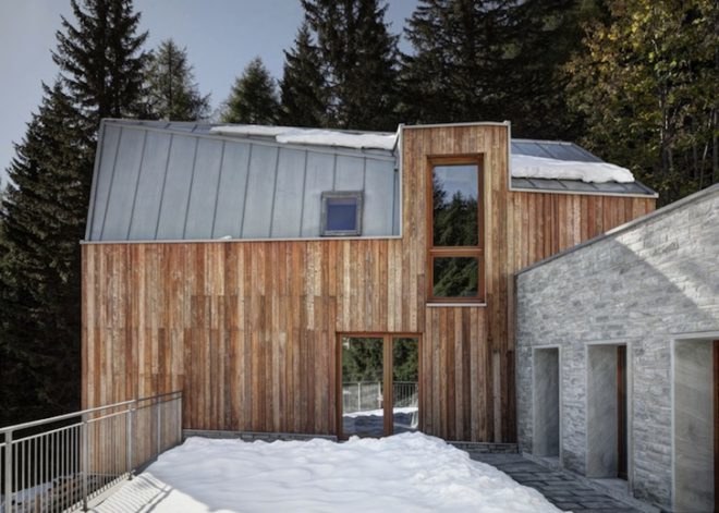 house in madesimo, ES-arch, Consalez Rossi Architetti Associati, zinc roof, lopsided roof, asymmetric roof, Rheinzink, untreated wood, larch, precast concrete panels, guest home, Madesimo, stone passageway, gray gneiss split stone