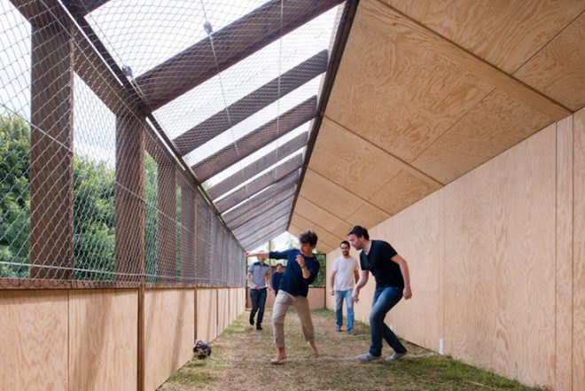 Guinée*Potin Architectes, Footcheball, long playground, thatched building, Nantes