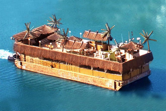 Debra Dawson, Miami-style, Tikki Beach Barge, party boat, drifting tropical island, palms, fake grass,