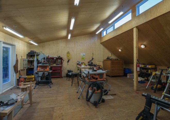 Omar Gandhi, OSB, plywood, Moore Studio, Nova Scotia, Canada, Canadian architecture, industrial fixtures, concrete flooring, nova scotia vernacular, clerestory window, natural light, wood cabin, cabin, artists retreat, artist studio