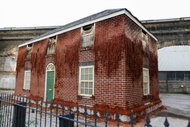 Alex Chinneck, A pound of flesh for 50p, london art, melting house, urban art london, Bankside Merge Festival, paraffin wax bricks, levitating market building,