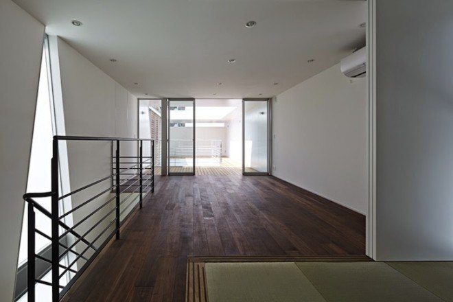 House in Tatemachi, Masao Yahagi Architects, Kitakyushu, Japan, cone-shaped void, natural daylight, ventilation, privacy, wooden louvers, open tread stairs, inner courtyard,