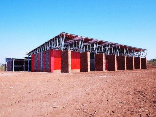 Malawi, shipping containers, architecture for a change, solar energy, rainwater harvesting, primary school, off grid, John Saaimen, prefab, prefab school, bamboo ceiling, shade netting, cross ventilation, sustainable architecture, prefab architecture, Legson Kayira Community Center & Primary School