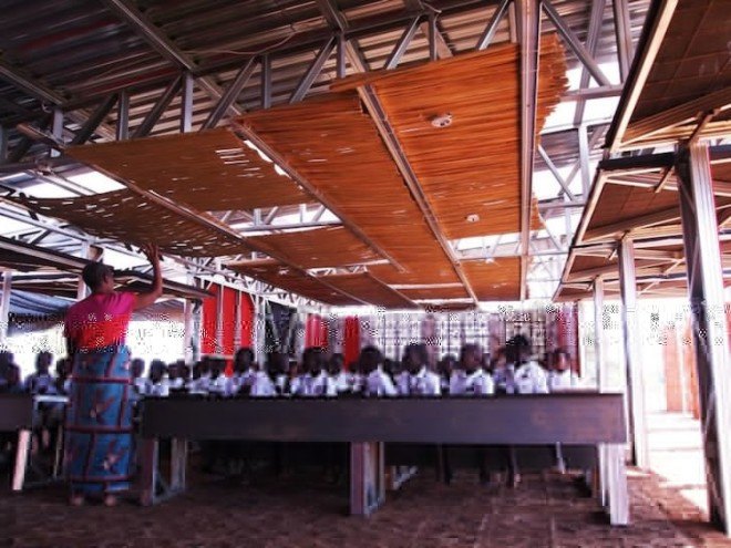Malawi, shipping containers, architecture for a change, solar energy, rainwater harvesting, primary school, off grid, John Saaimen, prefab, prefab school, bamboo ceiling, shade netting, cross ventilation, sustainable architecture, prefab architecture, Legson Kayira Community Center & Primary School